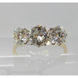AN 18CT GOLD THREE STONE DIAMOND RING the three diamonds are estimate approx combined 1.65cts,