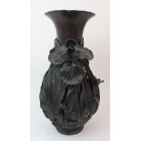 A JAPANESE BRONZE VASE pierced and cast in high relief with irises and aquatic foliage, signed to