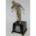 A WHITE-METAL FOOTBALL TROPHY MODELLED AS A FOOTBALLER on square wooden base with white-metal and