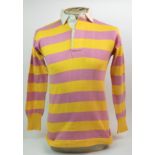 A PRIMROSE AND PINK SCOTLAND INTERNATIONAL SHIRT with button-up collar, blue short and blue and