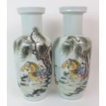 A PAIR OF CHINESE PORCELAIN VASES painted with fishermen beneath willow trees and surrounded by