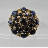 A 14CT GOLD SAPPHIRE CLUSTER RING with spiral design basket mount, head diameter 19.3gms, finger