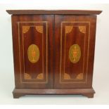 AN EDWARDIAN INLAID TABLE CABINET with hinged lid, opening to velvet interior with hinged front