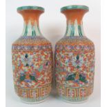 A PAIR OF CANTON RELIEF MOULDED BALUSTER VASES decorated with precious symbols within key pattern