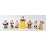 A BESWICK DISNEY GROUP OF SNOW WHITE AND SIX DWARFS including Bashful, Dopey, Sleepy, Doc, Happy and