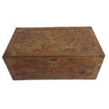 A CHINESE CAMPHOR WOOD COPPER BOUND BLANKET CHEST the top carved with peonies, the front dragons,