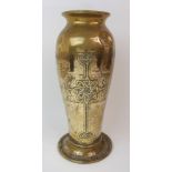 AN ALEXANDER RITCHIE BRASS VASE of tapering form and embossed with a Celtic knotwork cross to both