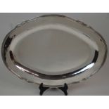 A PERUVIAN SILVER PLATTER marked 925, of oval form with ribbed and scalloped edge, 45cm x 32cm,