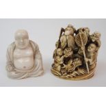 AN IVORY OKIMONO OF A DRAGON KING GROUP surrounding a dragon amongst crashing waves, signed, 6cm