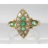 AN 18CT GOLD EMERALD AND ROSE CUT DIAMOND RING in marquis shape, finger size approx G1/2, weight