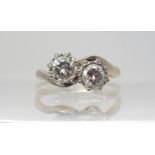 A TWIN STONE DIAMOND RING of estimated approx 0.60cts combined in cut back star setting. mounted