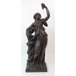 AFTER CLAUDE MICHEL CLODION - A BRONZE SCULPTURE OF A CLASSICAL WOMAN modelled standing eating