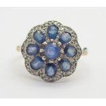 AN 18CT GOLD SAPPHIRE AND DIAMOND FLOWER RING finger size N, weight 3.4gms Condition Report: