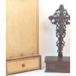 A LATE 19TH CENTURY CARVED WOOD CRUCIFIX with hinged lid base, the reverse inscribed in wooden