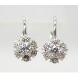 A PAIR OF 18CT WHITE GOLD DIAMOND FLOWER EARRINGS with continental ear wire drop setting. Diamonds