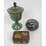 A CHINESE CLOISONNE CIRCULAR BOX AND COVER decorated with a landscape, 9cm diameter, a goblet and