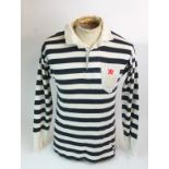 A BLACK AND WHITE QUEEN'S PARK FOOTBALL SHIRT No.7, with button-up collar and embroidered cloth