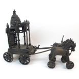 AN INDIAN BRASS THRONE CARRIAGE and a pair of horses, the domed canopy throne supported by six