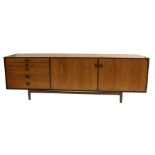 A KOFOD LARSEN FOR G-PLAN TEAK SIDEBOARD with five drawers and two doors on stand with square