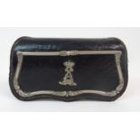 A CARTRIDGE POUCH probably 19th Century, leather and steel with white metal trim and a crest, a