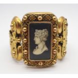 A HIGH GOTHIC COSTUME JEWELLERY BANGLE with painting of a Queen on parchment under glazed panel,