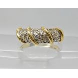 AN 18CT GOLD DIAMOND DRESS RING set with estimated approx 0.30cts of brilliant cut diamonds set in