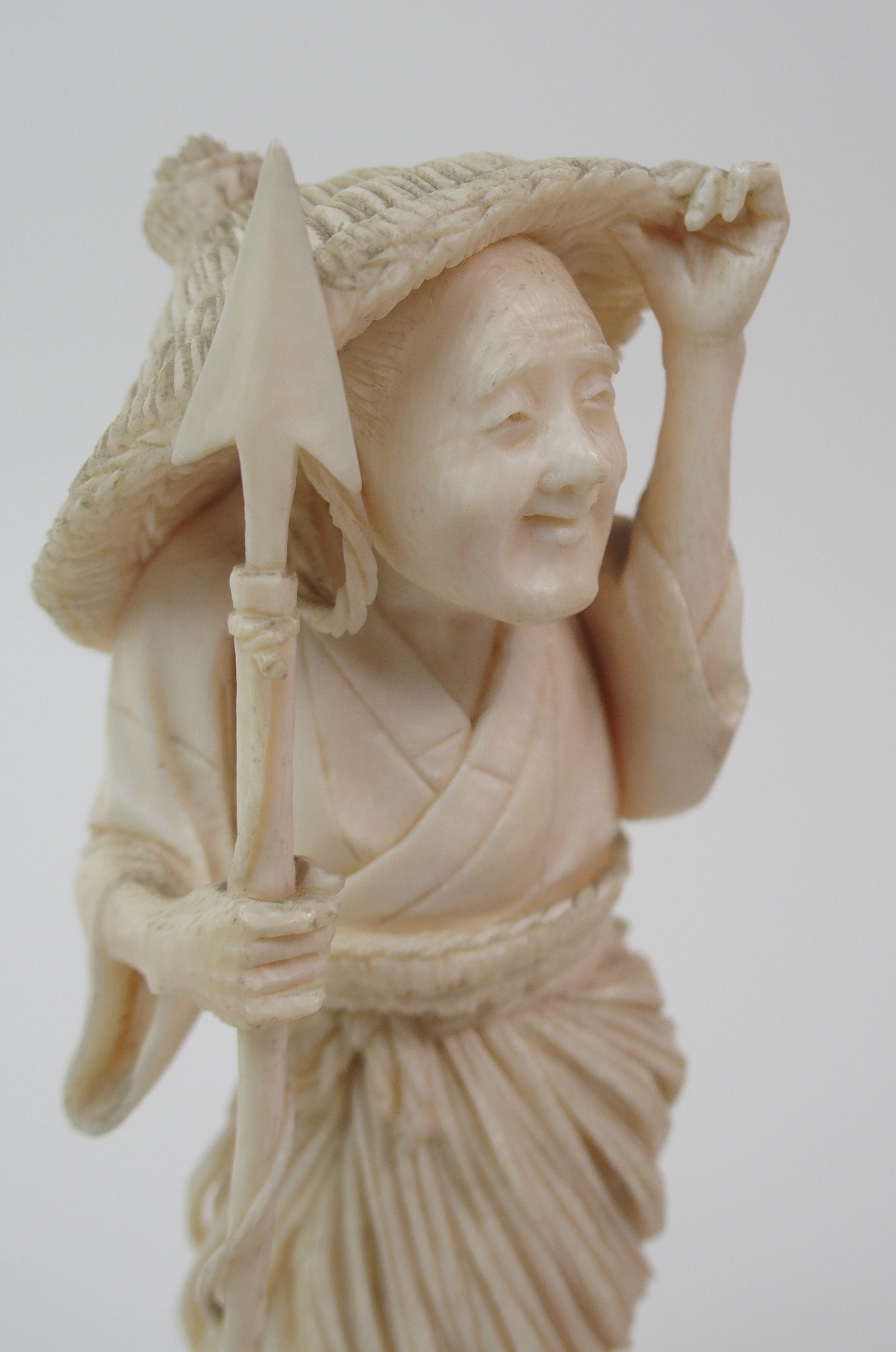 AN IVORY OKIMONO OF A FISHERWOMAN holding a harpoon, 17cm high and a farmer feeding chickens, 16.5cm - Image 10 of 10