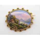 A PAINTED ENAMEL BROOCH DEPICTING THE SWISS RESORT GRUTLI the well painted plaque is 2.8cm x 2.