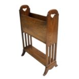 AN ARTS AND CRAFTS OAK AND CHEQUER INLAID MAGAZINE RACK with pierced heart shaped handles above
