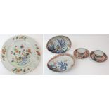 A CHINESE FAMILLE ROSE CHARGER painted with cockerels amongst foliage and blue rockwork within a