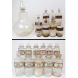 A LARGE CHEMISTS DISPLAY BOTTLE AND STOPPER 38cm high, three clear glass chemists bottles with glass