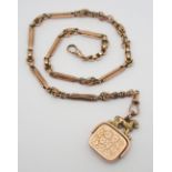 A 9CT GOLD FANCY LINK FOB CHAIN WITH ATTACHED SEAL WITH LION FINIAL chain has a soldered on 9c