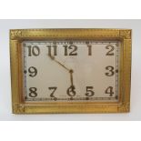 A GOLDSMITHS AND SILVERSMITHS GILT 8 DAY MANTLE CLOCK of rectangular form with Arabic numerals,
