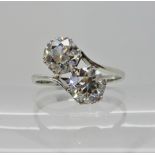 A WHITE METAL TWIN STONE DIAMOND RING the twin diamonds of estimated approx 2.05cts combined, are
