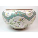 A LARGE CLEMENT MASSIER GOLFE JUAN JARDINIERE painted with flowers and insects on a white and gilt