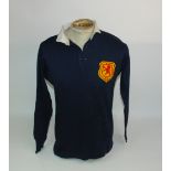 A BLUE SCOTLAND V. ENGLAND INTERNATIONAL SHIRT, 1912 with button-up collar and embroidered cloth