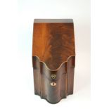 A GEORGE III MAHOGANY SERPENTINE KNIFE BOX converted to decanter box with hinged sloping lid, with