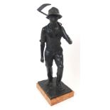 A BRONZE FIGURE OF A FARMER modelled holding a scythe, signed to base Weinmann Grunwald, upon orange