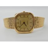 A 9CT GOLD LADIES TISSOT QUARTZ WRISTWATCH with square dial gold dial and baton numerals, textured