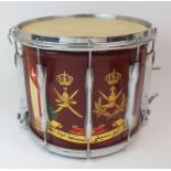 A PREMIER, ENGLAND SNARE DRUM painted with an Arabic crest and writing, with drum sticks, carry