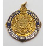 A 10K GOLD AND ENAMEL TOUR OF CANADA MEDAL the obverse inscribed Dominion of Canada Football
