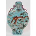 A CHINESE PILGRIM FLASK VASE painted with dragons amongst magnolia and peonies on a lilac ground