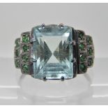 A WHITE METAL DRESS RING SET WITH AQUAMARINE AND EMERALDS aquamarine approx 10.9mm x 8.1mm x 7.