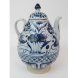 A CHINESE MING STYLE BLUE AND WHITE WINE POT painted with ducks and aquatic foliage (cover damaged