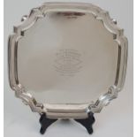 A SILVER SALVER by Walker & Hall, Sheffield 1935, of square form with scalloped corners and