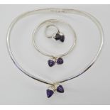 A SUITE OF DANISH SILVER JEWELLERY WITH AMETHYST ACORN FINIALS BY BENT KNUDSEN the torc style