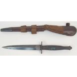 A FAIRBAIRN-SYKES FIGHTING KNIFE with ribbed hilt, the double edged blade marked the F-S Fighting