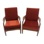 A PAIR OF DANISH STYLE 1960'S TEAK ARMCHAIRS with sculptured arms, 76cm high (2) This item is