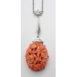 A 9CT WHITE GOLD ART DECO CARVED CORAL PENDANT the coral is carved with flowers, length of the