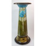 A MINTON SECESSIONIST JARDINIERE STAND with tube lined stylized floral decoration above a checked